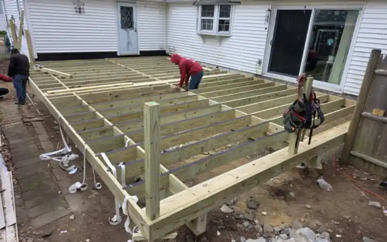 New deck framing with pressure-treated joists and posts
